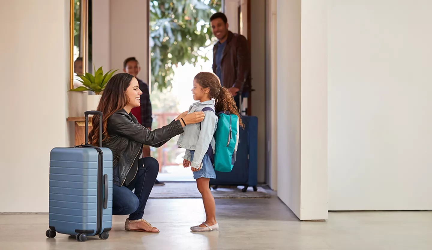 person with a child and luggage