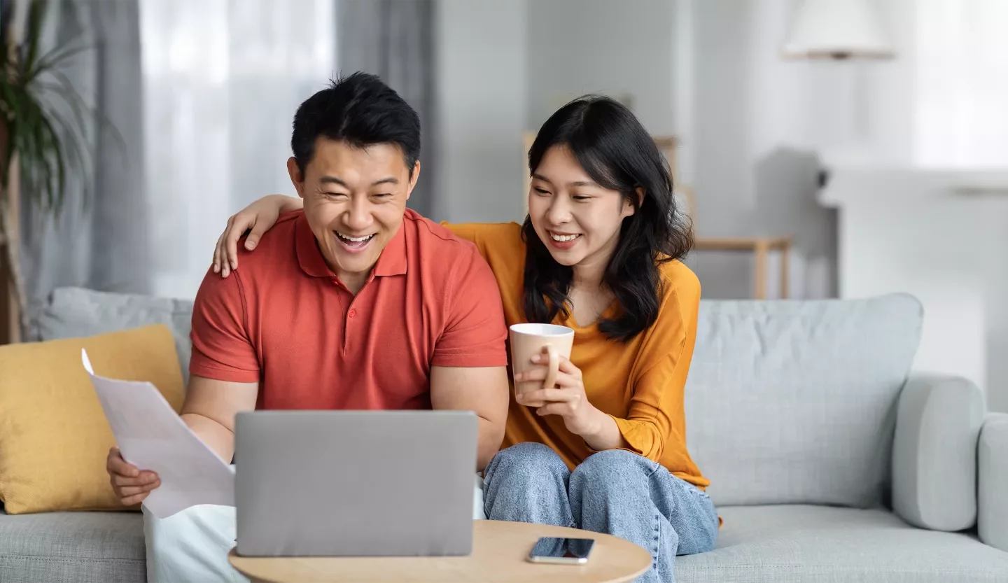 two people on laptop